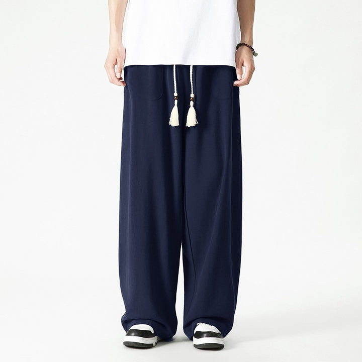 Men's loose-fitting lounge pants with tassel cord, elastic waistband, and patch pockets Mune Fashion