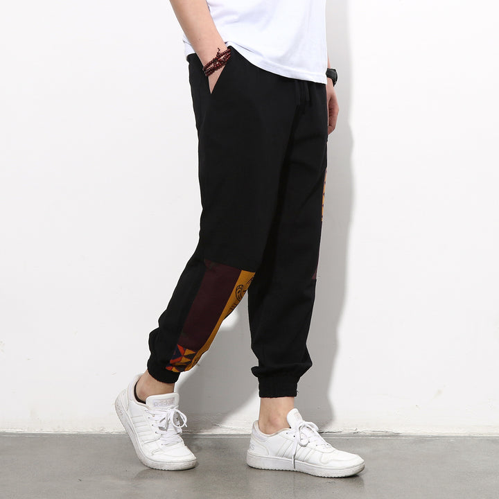 Men's jogging pants with side panel prints, drawstring and ribbed cuffs Mune Fashion