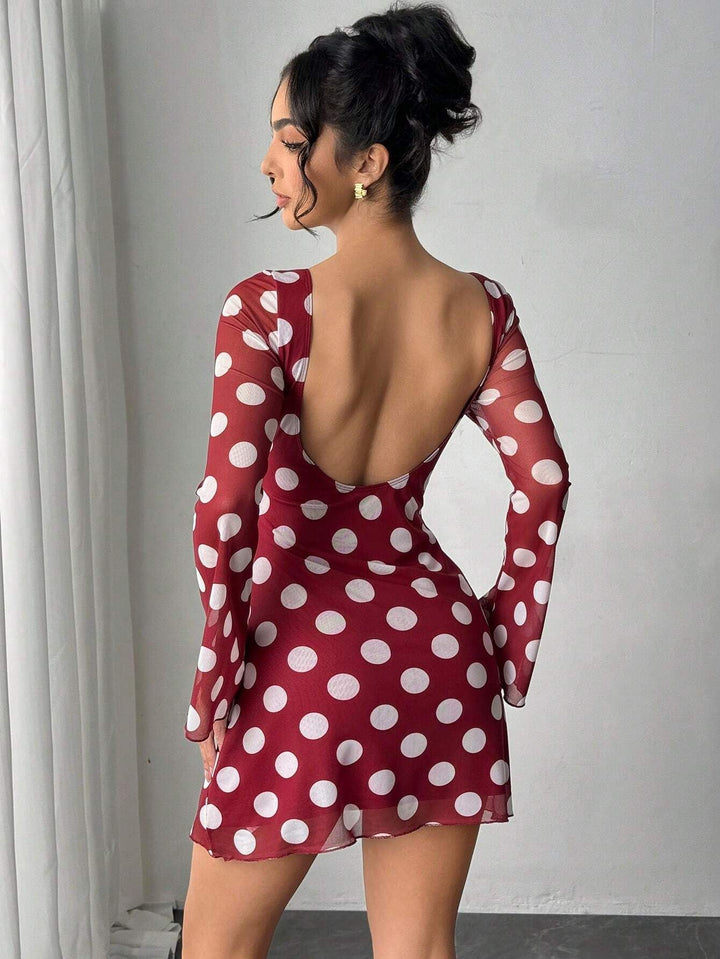 Women's figure-hugging transparent mesh mini dress with deep back neckline and polka dot pattern Mune Fashion