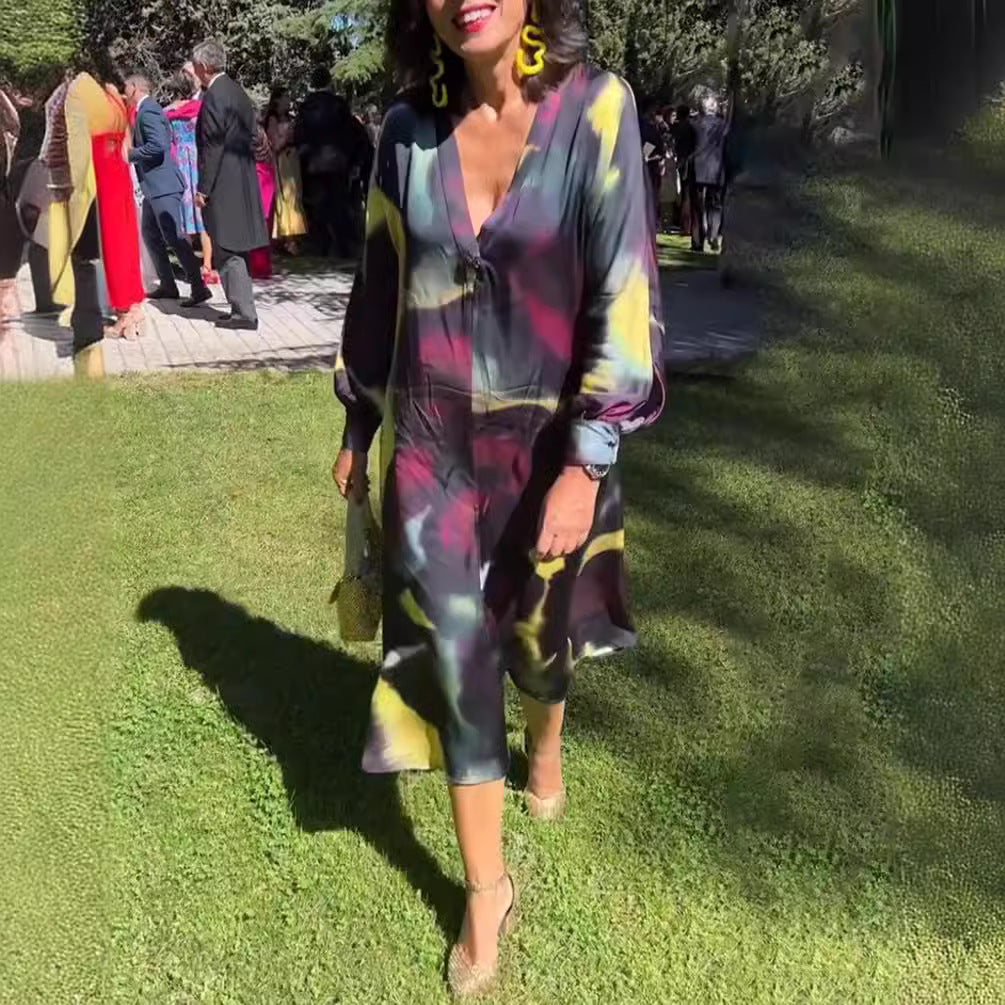 Women's flowing midi dress with abstract print, V-neckline, balloon sleeves, and decorative closure Mune Fashion
