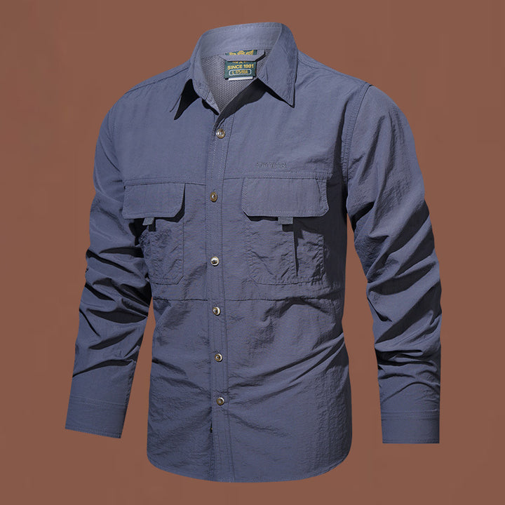 Men's lightweight functional long-sleeve utility shirt with patch chest pockets and breathable nylon blend.