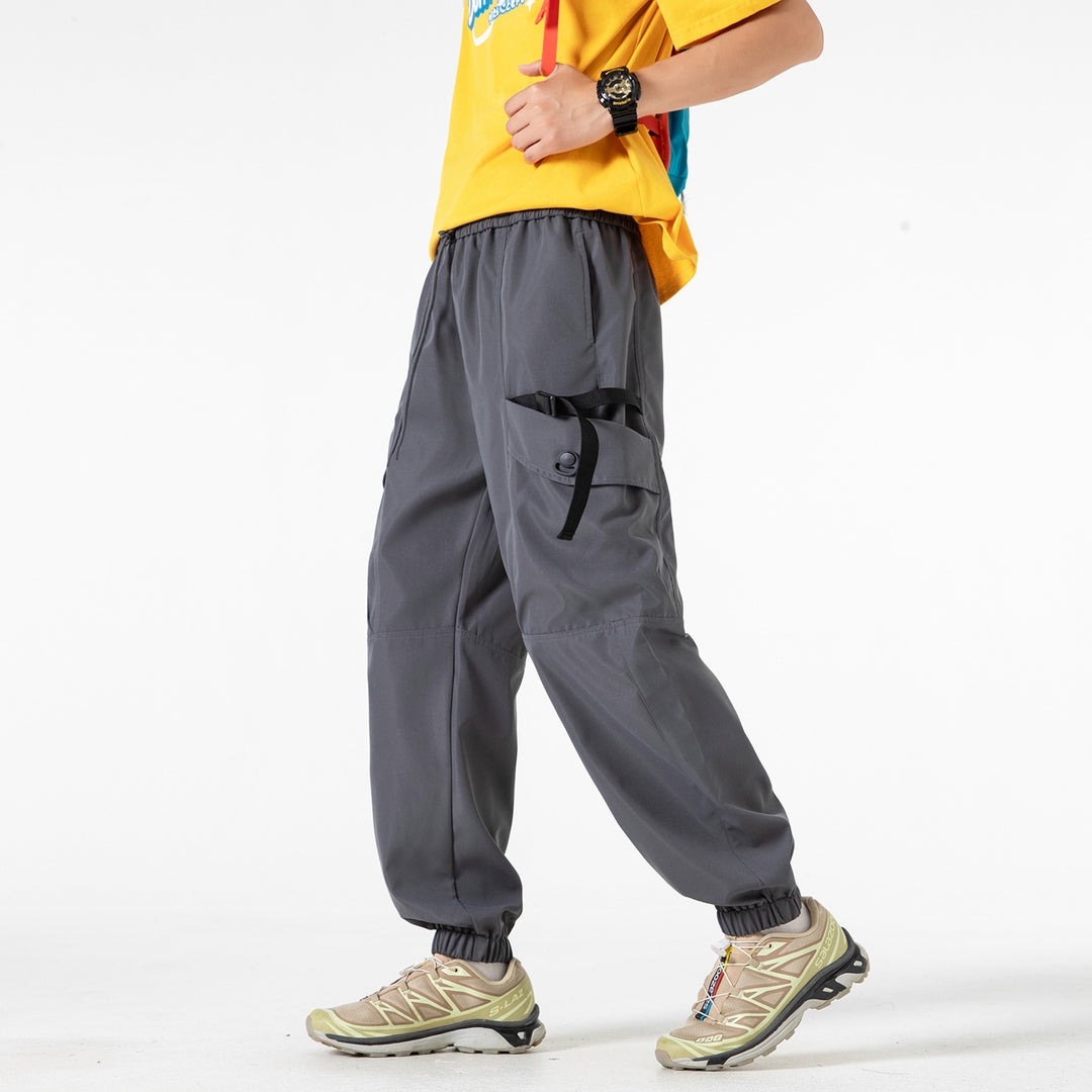 Unisex Wide Technical CargoJogging Pants with adjustable drawstring, large flap pockets, and elastic ankle cuffs Drune