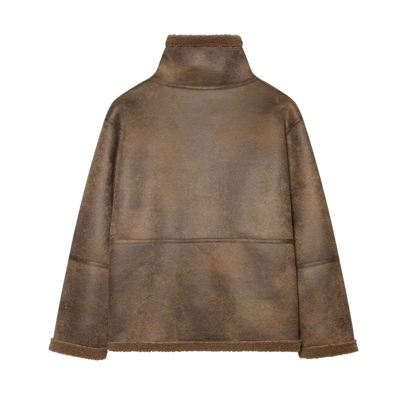 Ladies short jacket in lambskin look with stand-up collar, button and buckle closure Mune Fashion