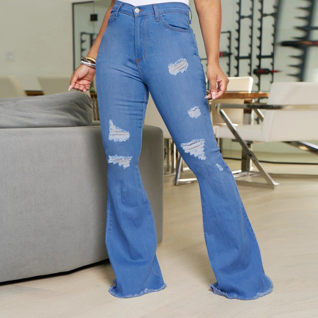 Ladies' waist-fitting flared jeans with ripped inserts and raw hem Mune Fashion