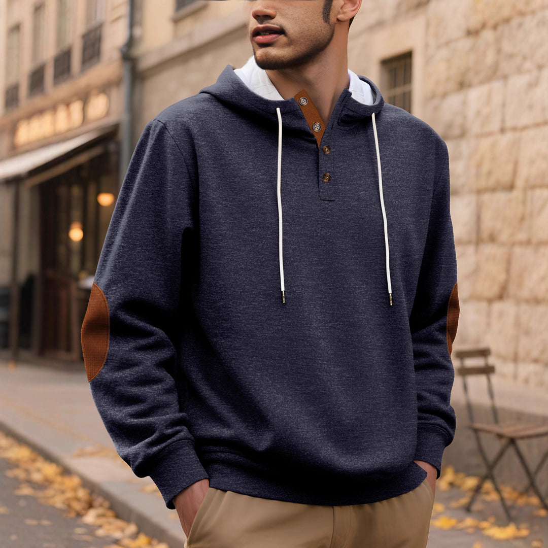 Men's hooded sweatshirt in a puristic leisure style with Henley button placket, contrasted hood interior, and elbow patches Mune Fashion