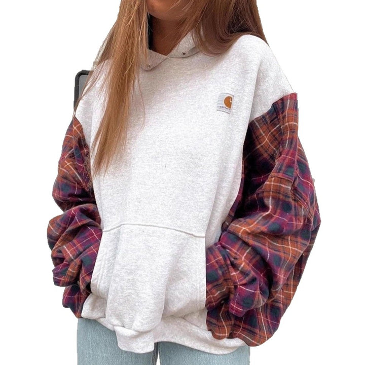 Women's oversized hoodie with checkered flannel sleeves and kangaroo pocket Mune Fashion