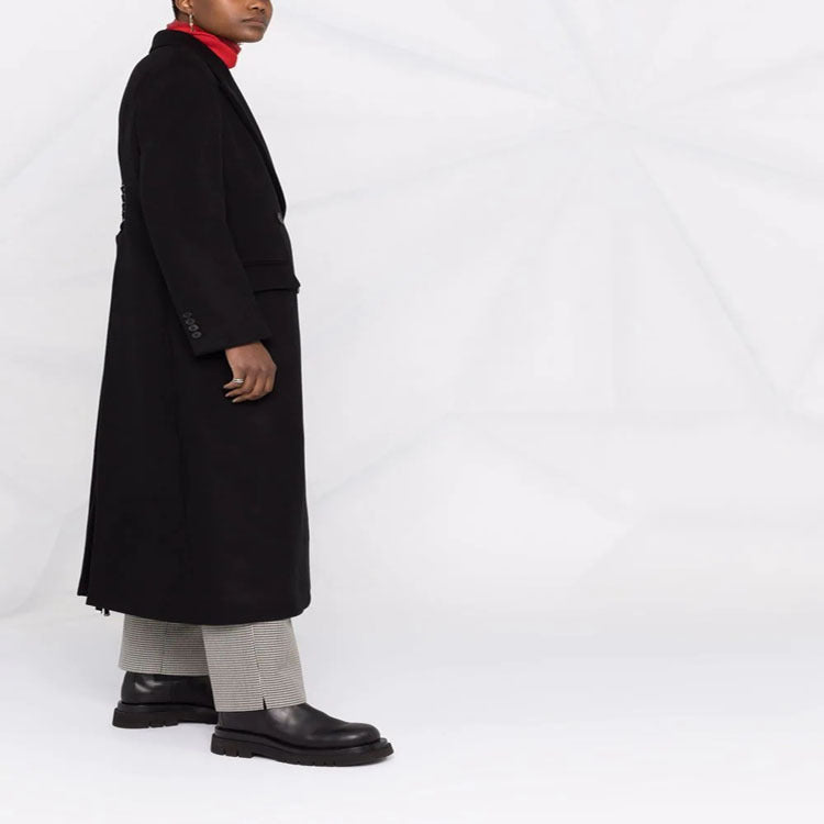 Women’s long coat in minimalist double-breasted style with tailored silhouette and flap pockets Mune Fashion