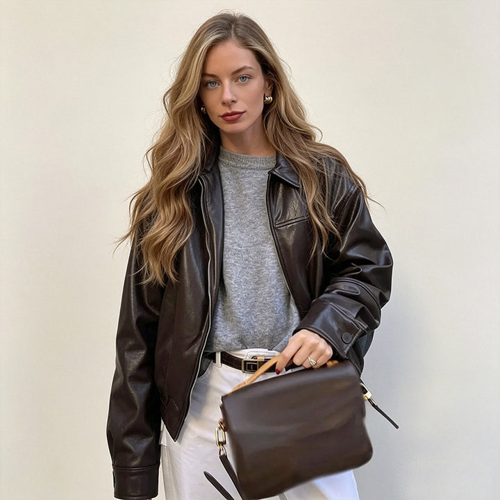 Women's short jacket made of faux leather in oversized bomber style with shirt collar and elastic hem Mune Fashion