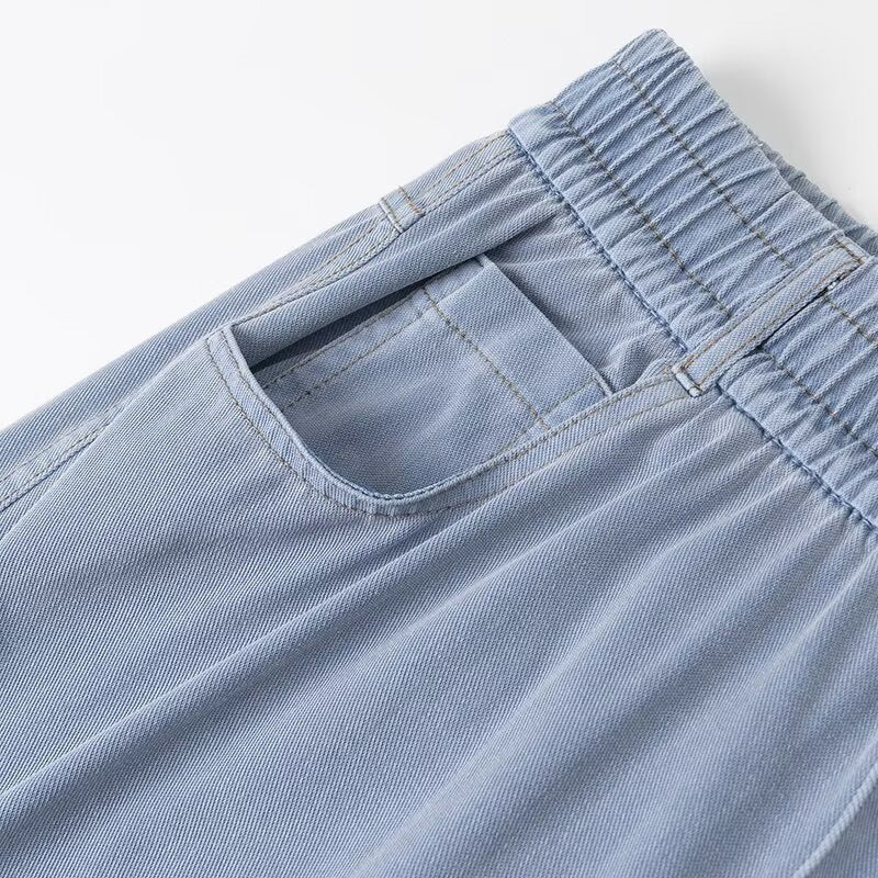 Women's loose high-waist lounge pants made of flowing viscose look with elastic waistband and side pockets Mune Fashion