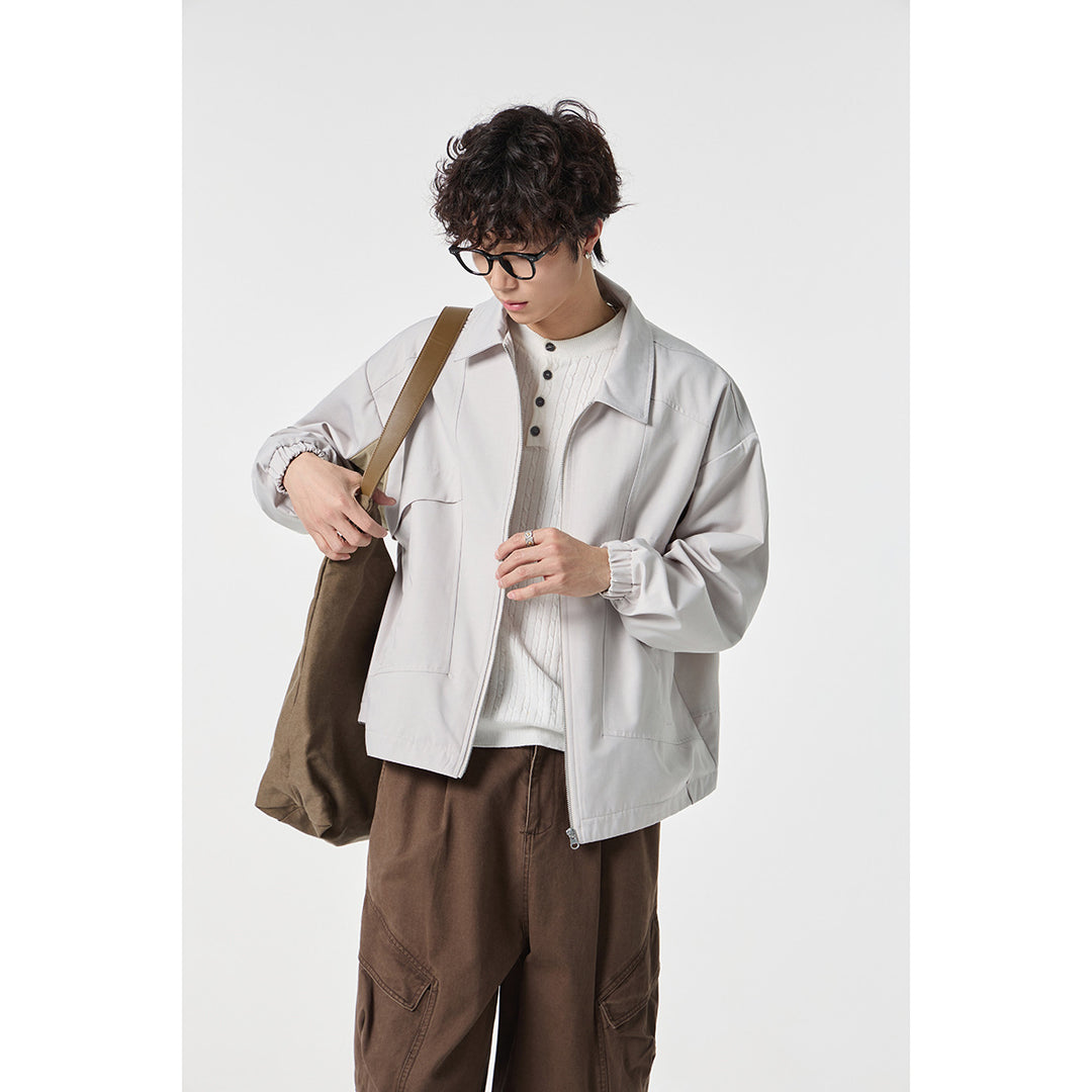 Unisex short jacket in boxy cut with continuous zipper and flap pockets Mune Fashion