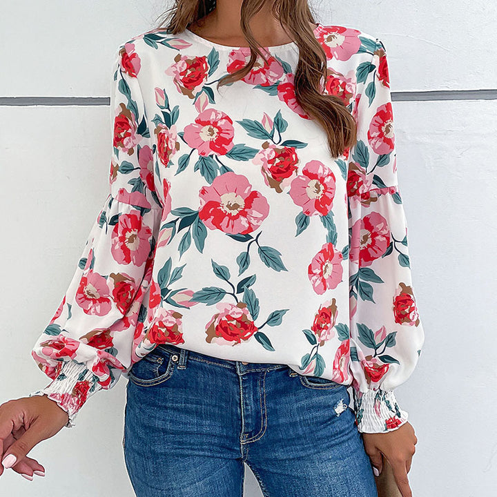 Ladies lightweight blouse with large floral print, volume sleeves and smocked cuffs Mune Fashion