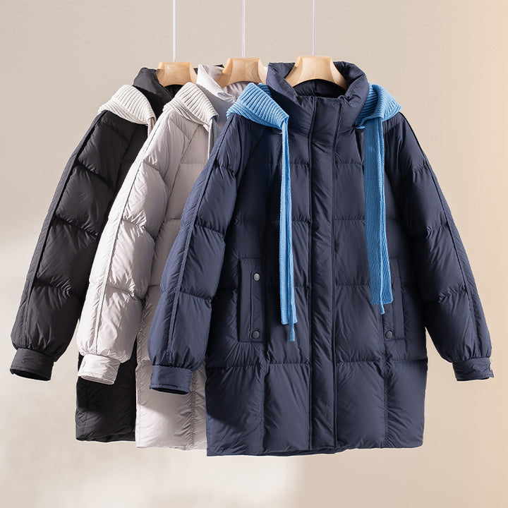 Women's padded quilted jacket with hood ribbed collar loose fit and midi length Mune Fashion