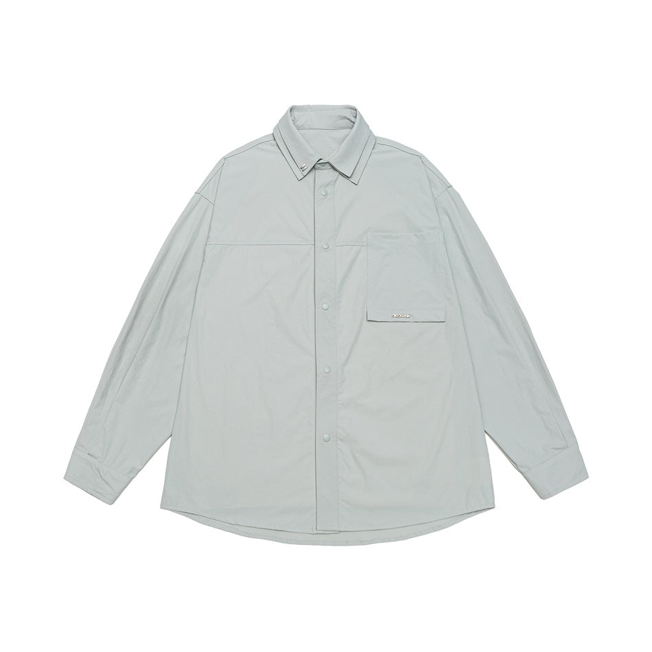 Unisex Oversize Shirt with technical material, breast flap and rounded hem Mune Fashion