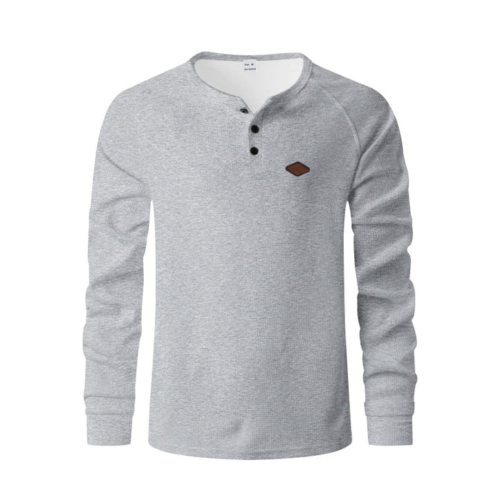Men's structured long-sleeve shirt with short button placket, raglan sleeves, and subtle logo application Mune Fashion