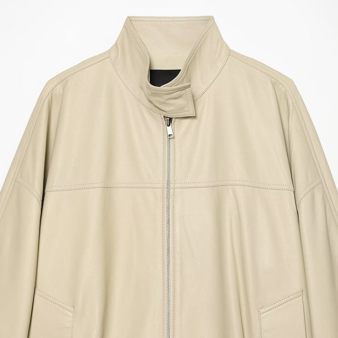 Women's loosely cut leather-look transitional jacket with stand-up collar, two-way zipper, and kangaroo pockets Mune Fashion