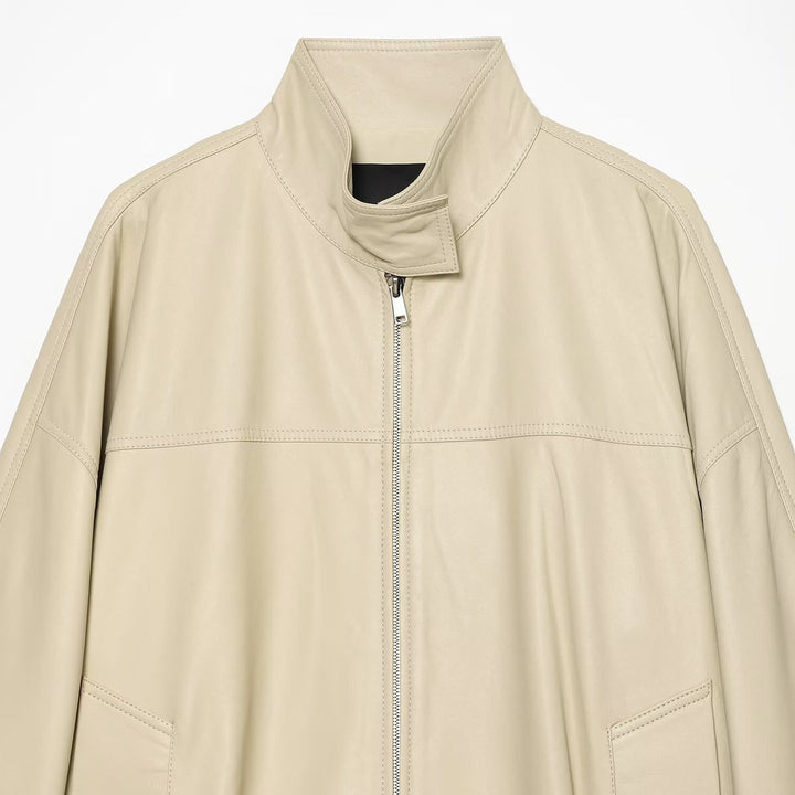 Women's loosely cut leather-look transitional jacket with stand-up collar, two-way zipper, and kangaroo pockets Mune Fashion