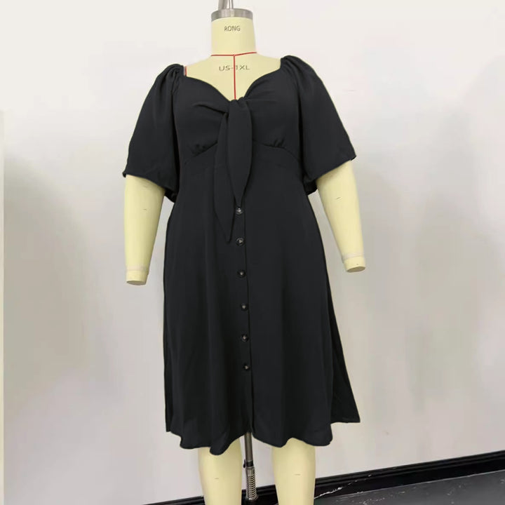 Women A-line midi dress with knot detail, puff sleeves and button placket Mune Fashion