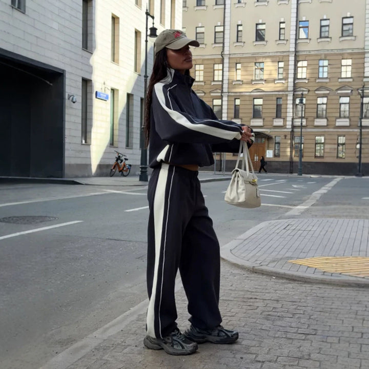 Women's oversized tracksuit with zip jacket, wide joggers, and contrast side stripes Mune Fashion