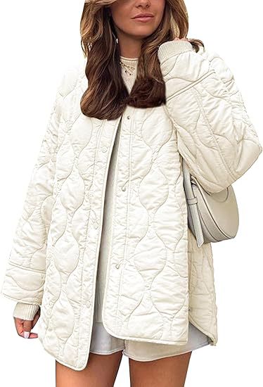 Women's quilted jacket in oversized design with curved quilting and side slit Mune Fashion