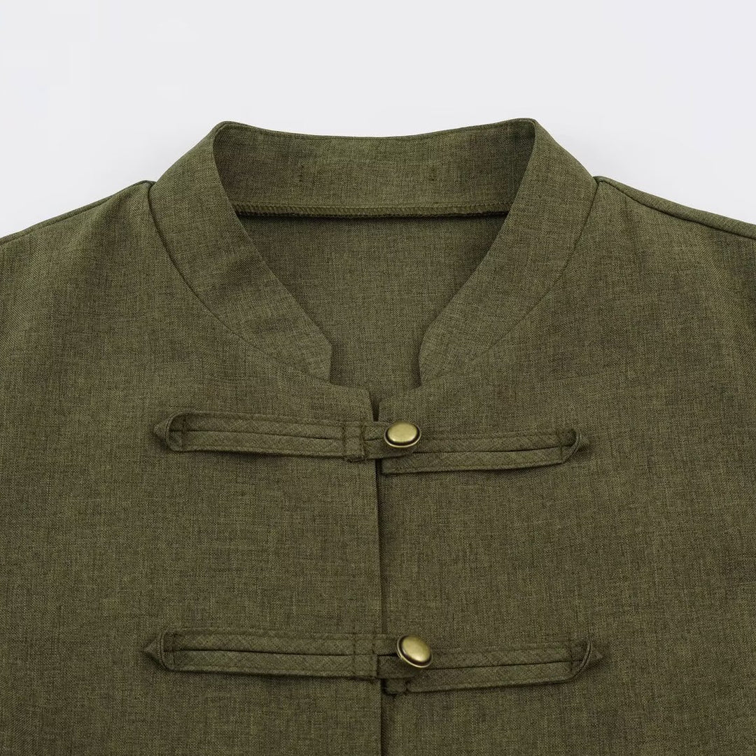 Women’s short jacket in Mandarin style with decorative toggle closures and tailored seam line Mune Fashion
