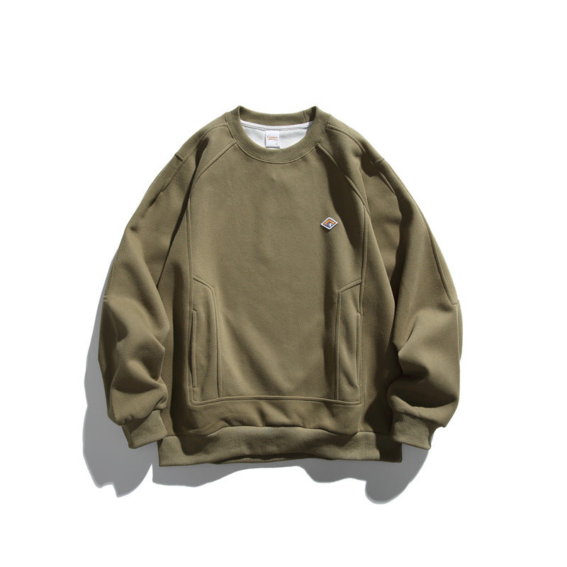 Unisex Oversize sweatshirt made of French terry with raglan sleeves, concealed side pockets, and a small logo patch Mune Fashion