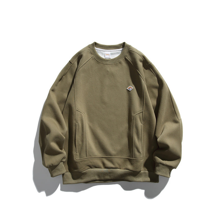 Unisex Oversize sweatshirt made of French terry with raglan sleeves, concealed side pockets, and a small logo patch Mune Fashion
