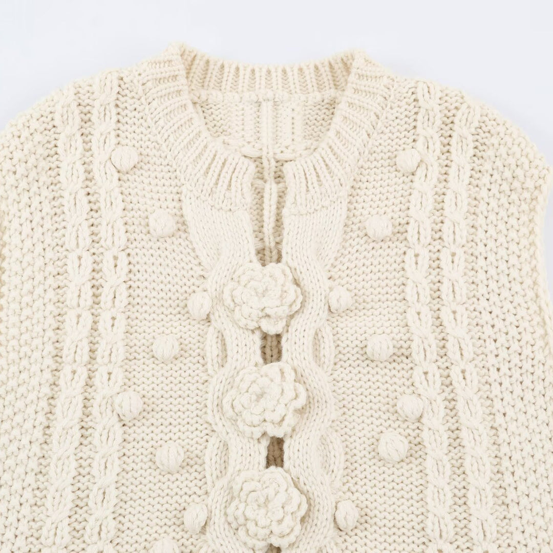Women's knitted vest with cable pattern, flower appliqués and bobble texture Mune Fashion