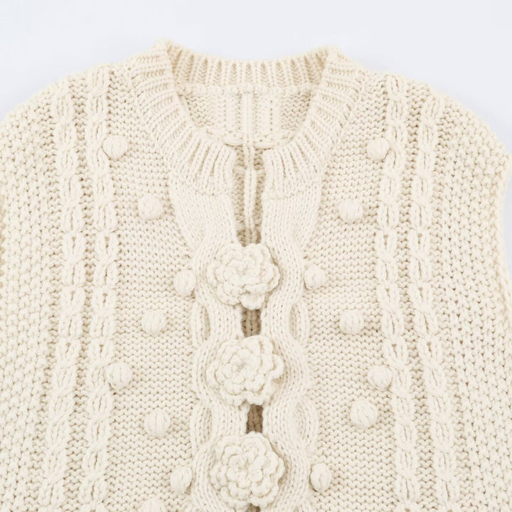 Women's knitted vest with cable pattern, flower appliqués and bobble texture Mune Fashion