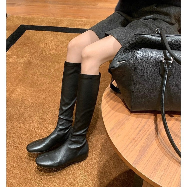 Women’s leather knee-high boots with a slim silhouette and flat heel Mune Fashion