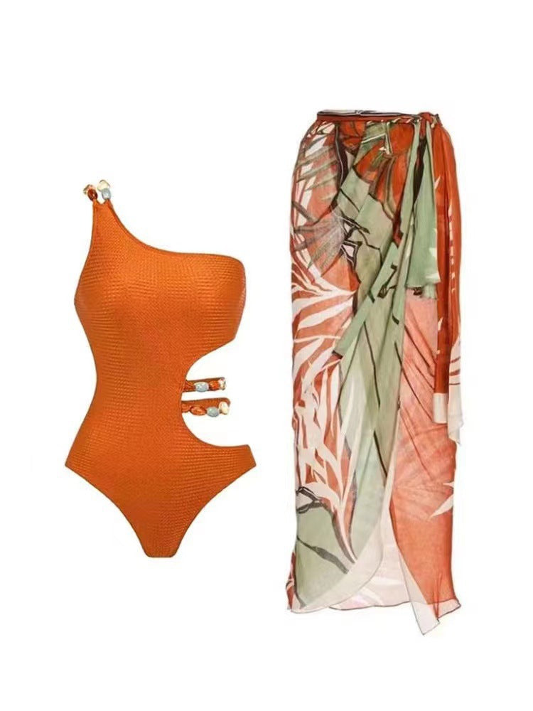 Women’s one-piece swimsuit with asymmetric cut and floral wrap skirt Mune Fashion