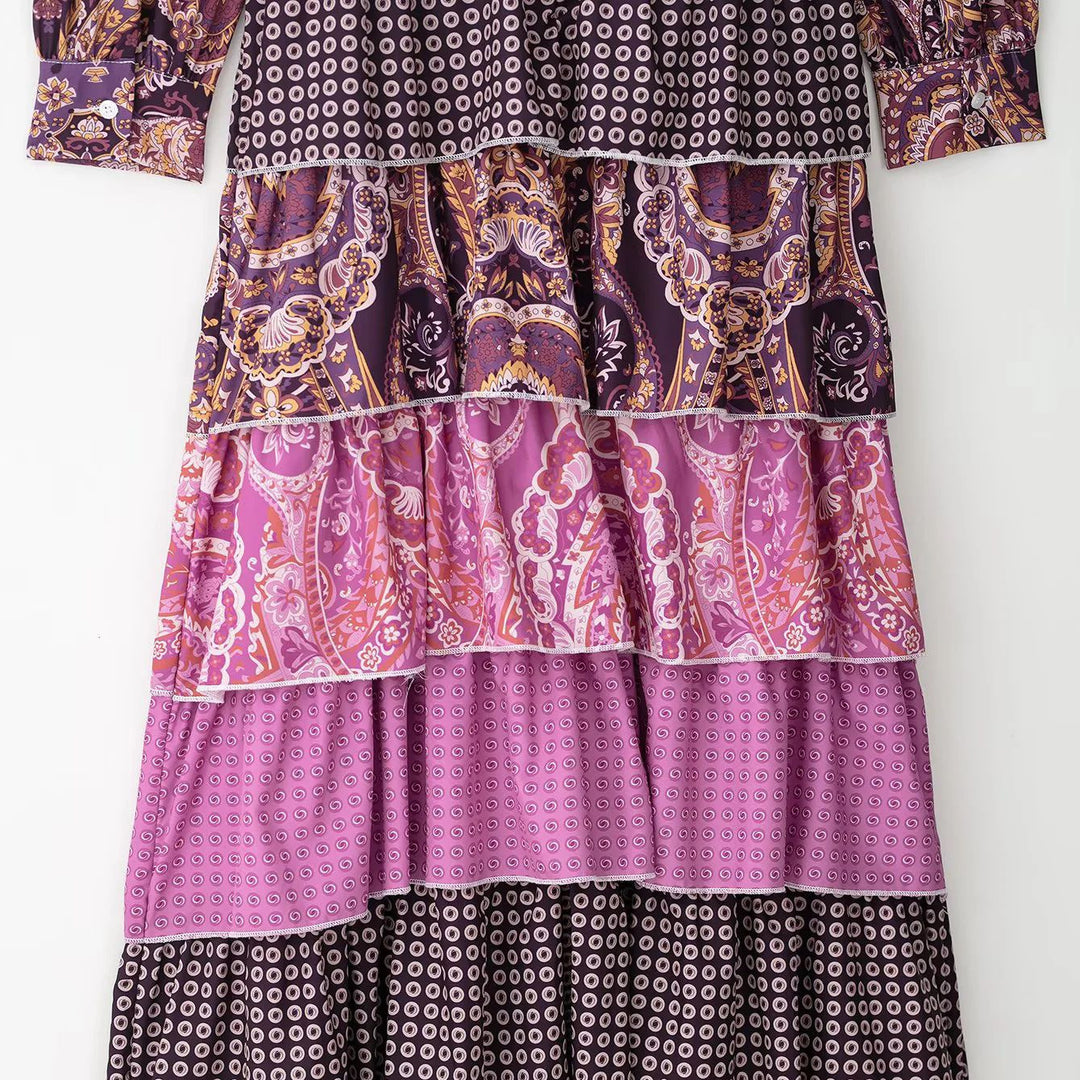 Women's layered maxi dress with paisley patchwork, bow collar, and long cuffed sleeves Mune Fashion