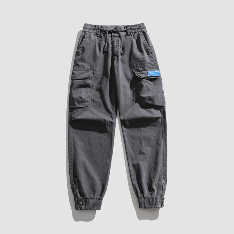 Herren Konisch geschnittene Utility-Cargo-Jogginghose mit Tunnelzugbund, Klapptaschen und Knöchelreißverschlüssen Mune Fashion