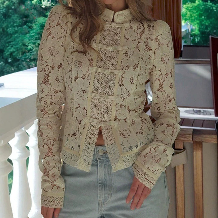 Women's figure-hugging lace blouse with stand collar, decorative knot closure, and crocheted hem Mune Fashion