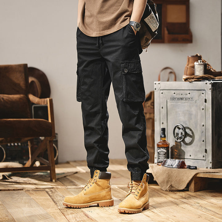 Men's robustly constructed cargo pants in jogger style with drawstring waistband, flap pockets, and elastic ankle cuffs Mune Fashion