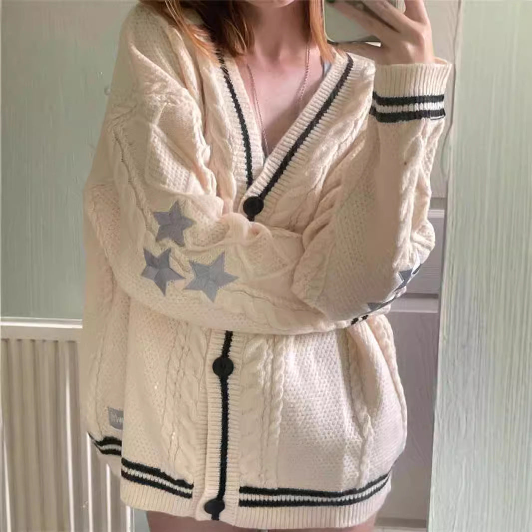 Women's oversized cable knit cardigan with V-neck, button placket and star appliqués Mune Fashion