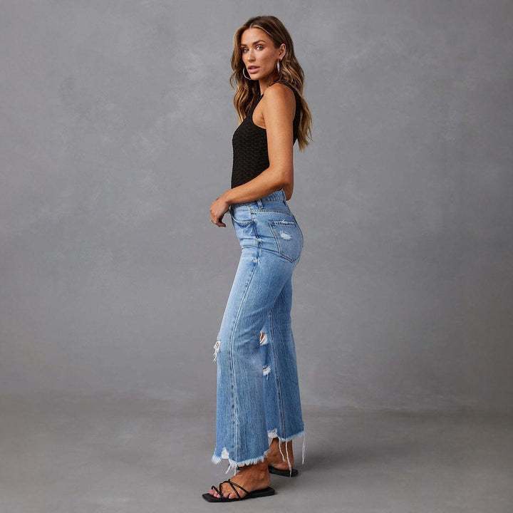 Women's high-waisted flared Destroyed Jeans with knee fraying and raw hem Mune Fashion