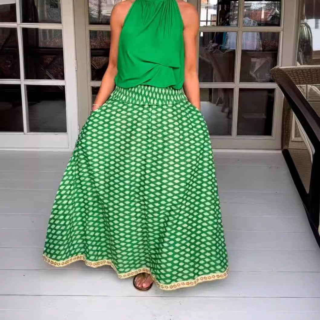 Women's two-piece halter neck set with gathered stand collar and patterned maxi skirt with elastic smocked waistband Mune Fashion