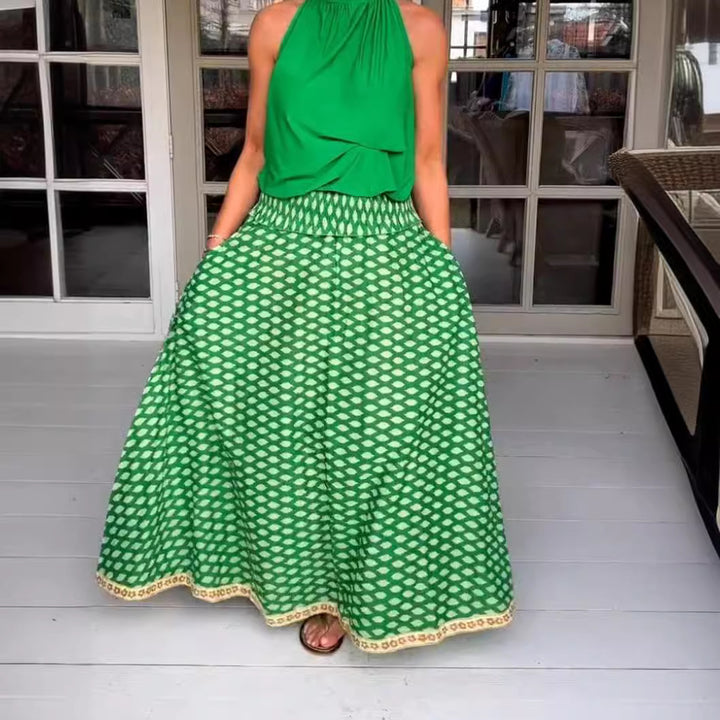 Women's two-piece halter neck set with gathered stand collar and patterned maxi skirt with elastic smocked waistband Mune Fashion