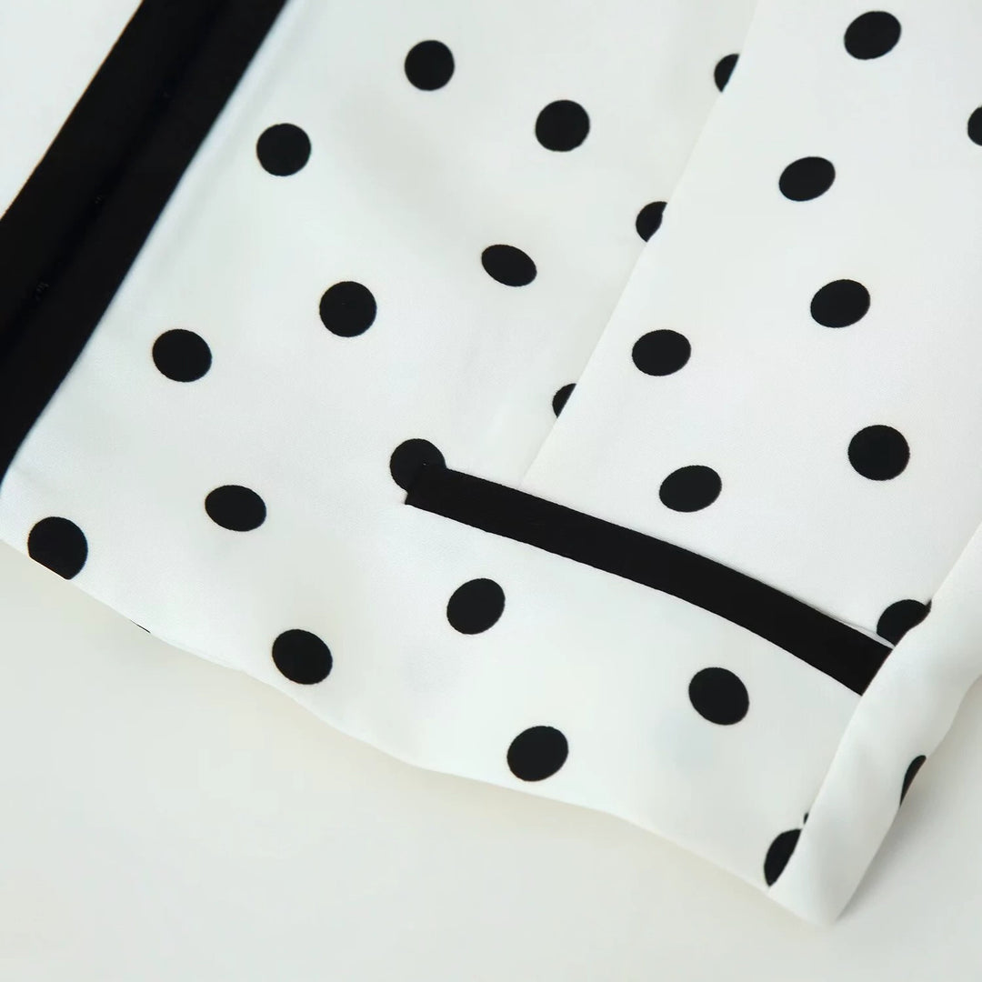 Women's short blazer in polka dot design with black contrast piping and round neck Mune Fashion
