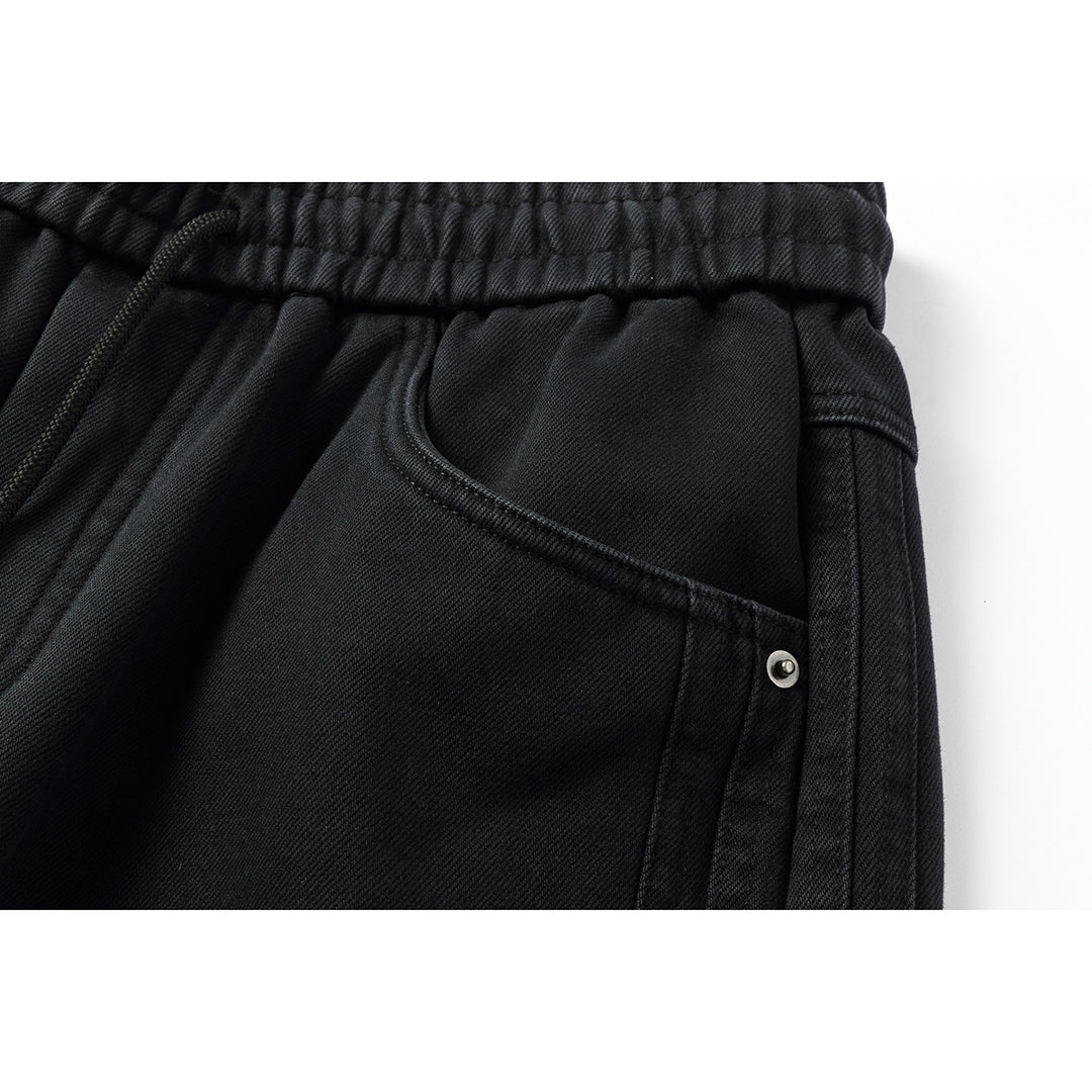 Women's wide high-waisted jeans with elastic waistband, drawstring, and decorative seams Mune Fashion