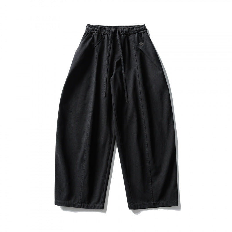 Unisex wide balloon pants made of cotton blend with drawstring waistband and decorative darts Mune Fashion