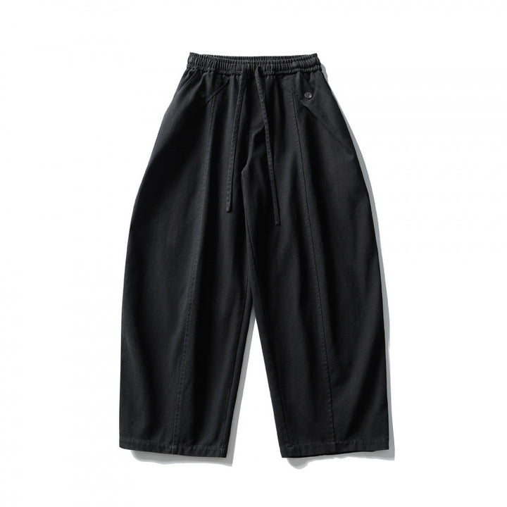 Unisex wide balloon pants made of cotton blend with drawstring waistband and decorative darts Mune Fashion