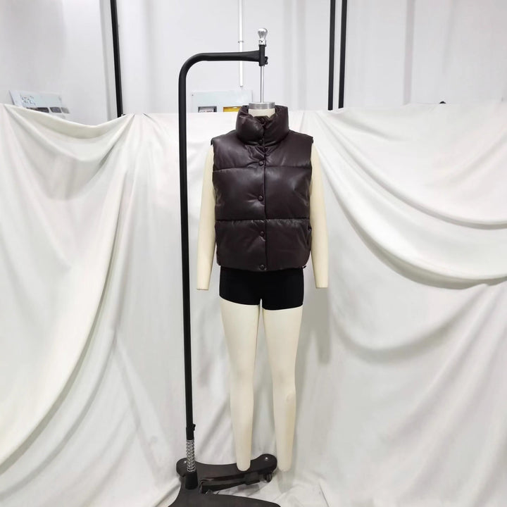 Ladies nan padded faux leather vest with high stand-up collar, snap button placket and waist drawstring Mune Fashion