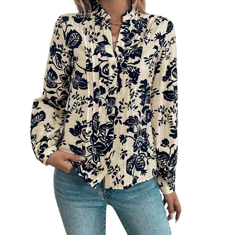 Women's loose-fitting blouse with stand-up collar, box pleats, and floral print Mune Fashion