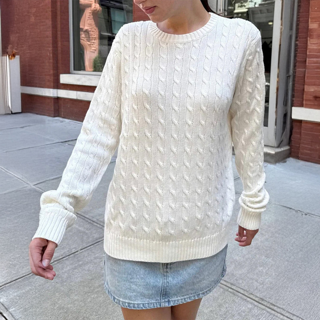 Women's large knitted cable knit sweater with round neckline, relaxed oversized fit, and ribbed cuffs Mune Fashion