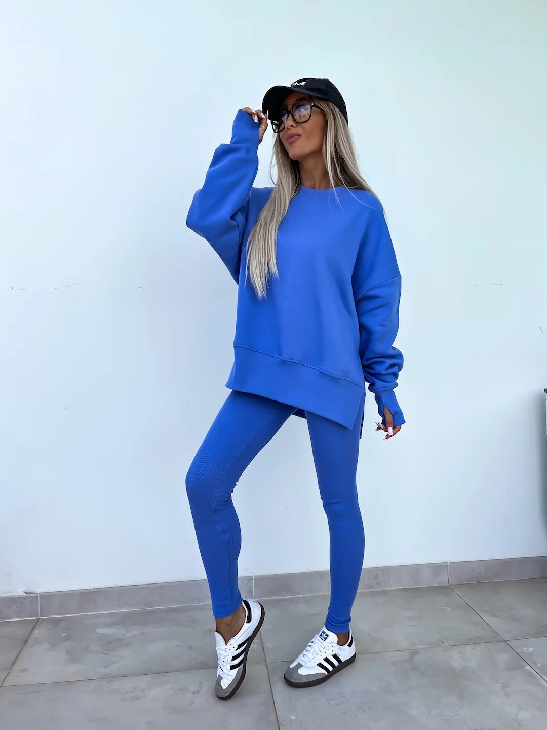 Women comfortable oversized lounge set with long sweatshirt, ribbed high-waist leggings and extended cuffs Mune Fashion