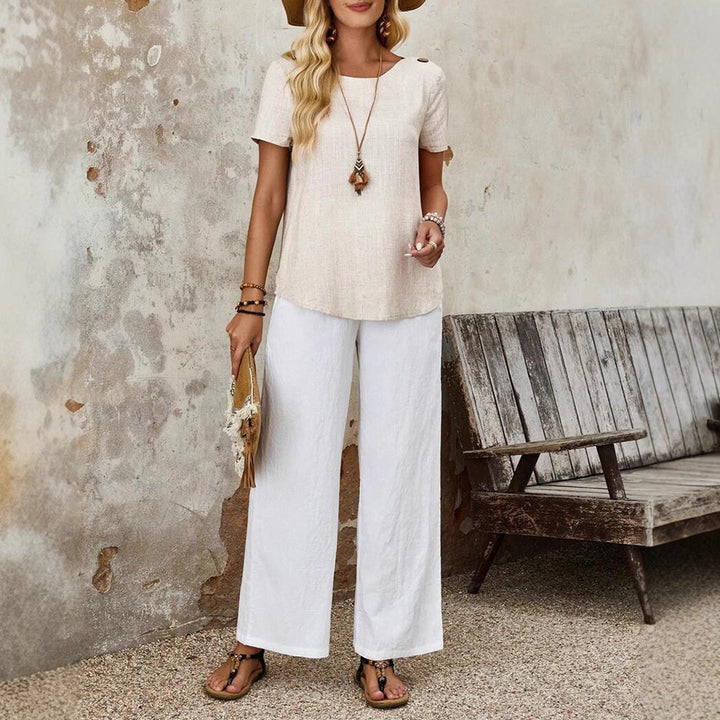 Women's cropped short-sleeve linen-look top with round neck, shoulder button placket, and rounded hem Mune Fashion