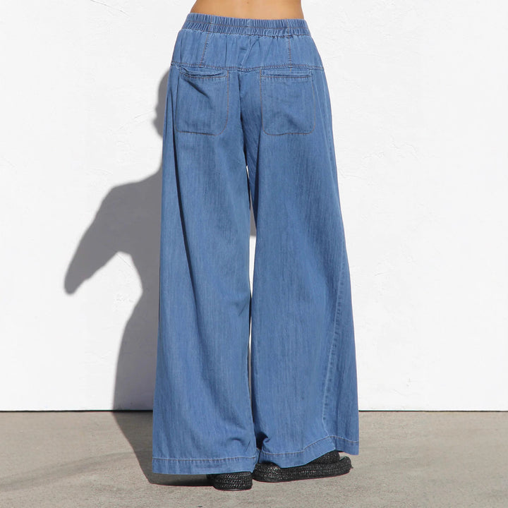 Women's wide high-waisted jeans with elastic waistband and decorative button placket Mune Fashion