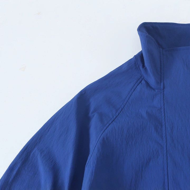 Women's Light Cropped Transition Jacket with Stand-Up Collar, Wide Raglan Sleeves and Drawstring Mune Fashion