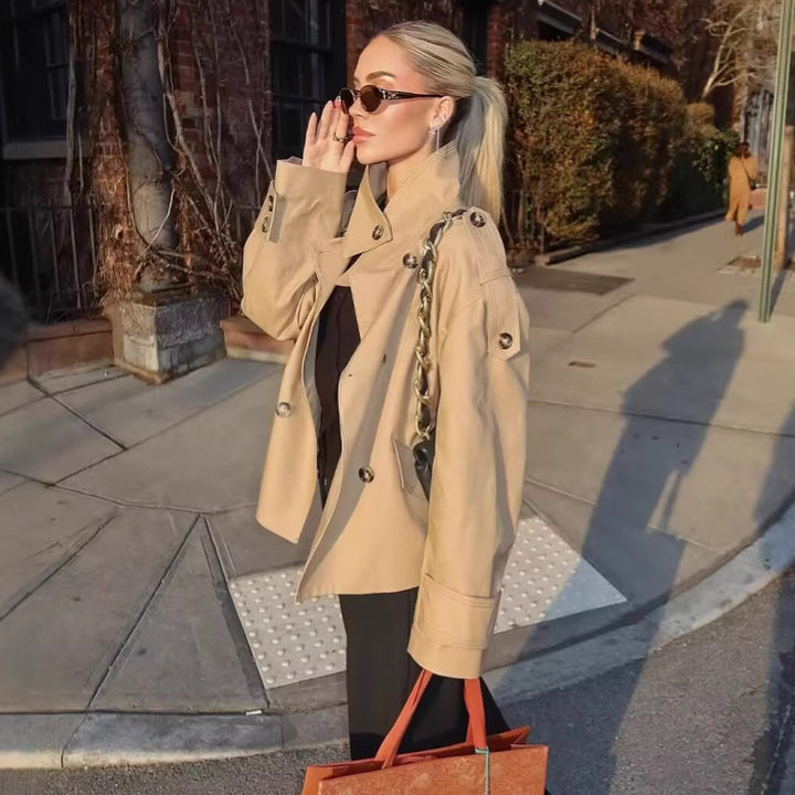 Women's short cut double-breasted trench coat with shoulder patches and patch flap pockets Mune Fashion